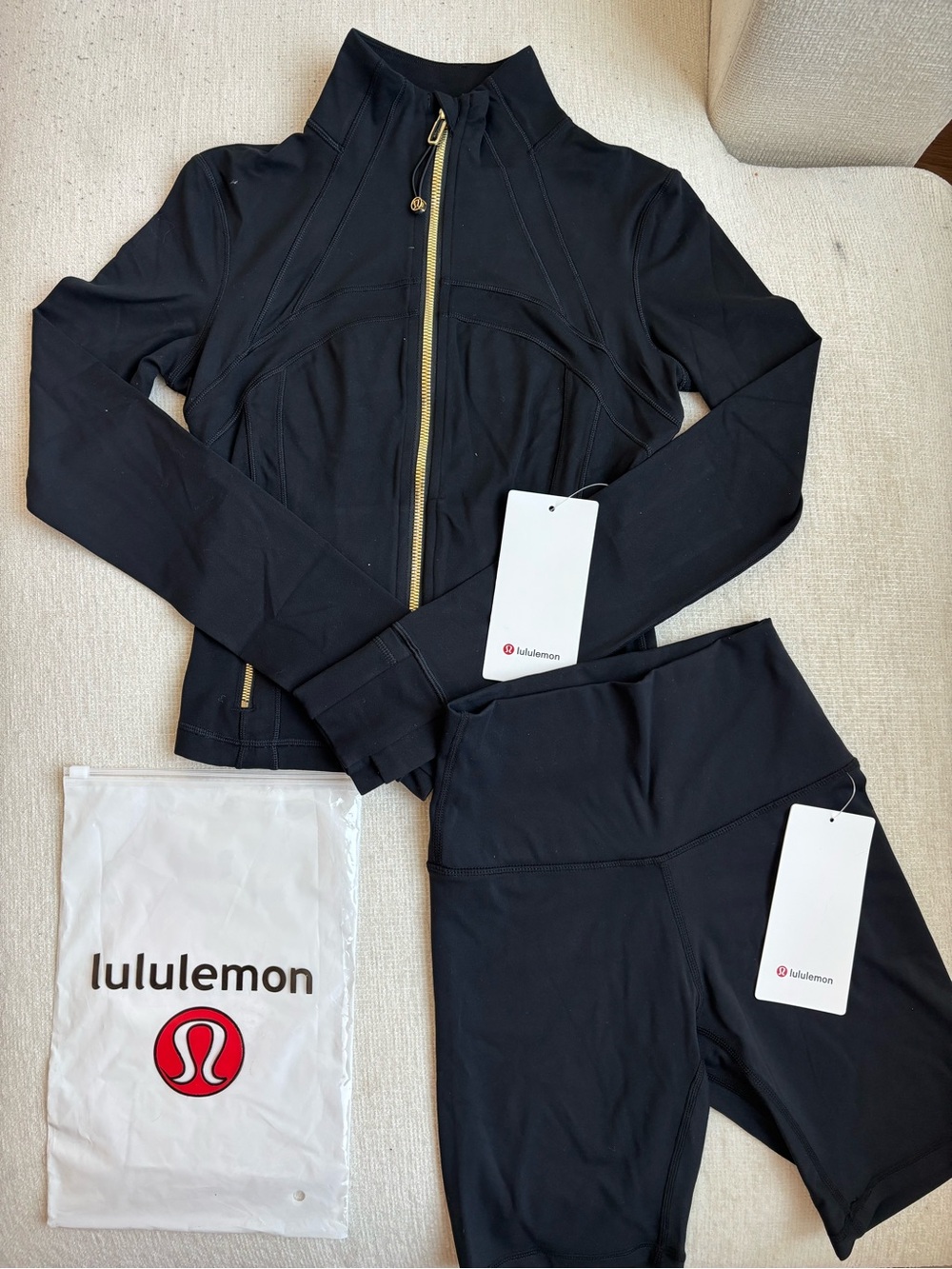 lululemon black cropped define jacket with gold hardware and shorts set